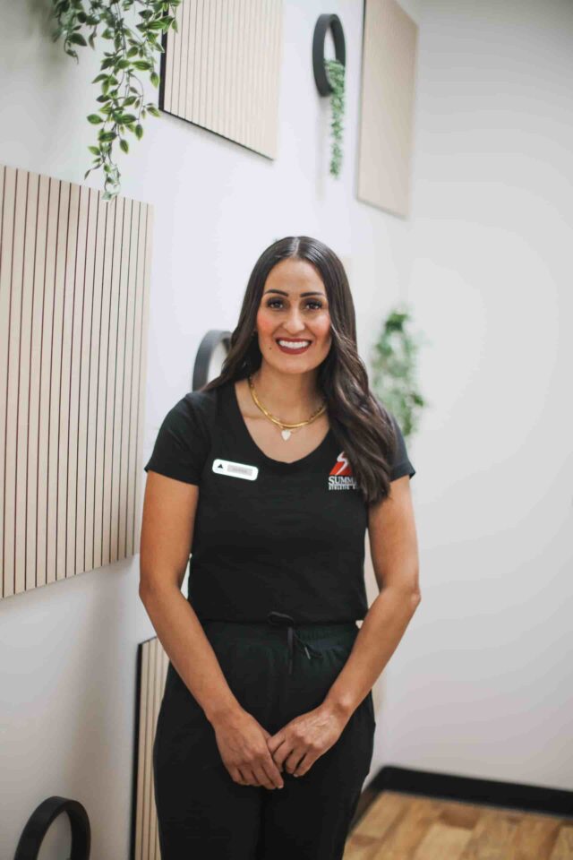 Staff preparing smoothies behind the counter at Summit Athletic Club’s smoothie bar